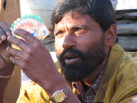 041204021540_concentrated_poker_player_at_ramnagar_bus_station