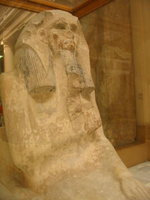 007_near_life_size_limestone_statue_of_a_seated_pharaoh