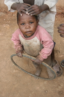 child and wheel Rawangi, East Africa, Tanzania, Africa