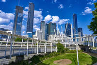 Modern Brisbane Skyline with Pedestrian Bridge 