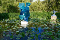 Blue Glass Sculpture in Lily Pond 