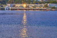 Waterfront building at sunset 