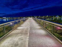 Illuminated pedestrian bridge at night 